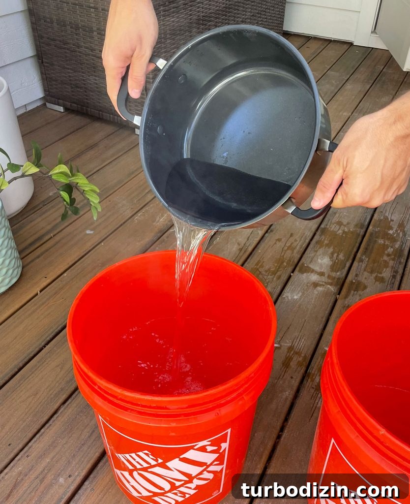 How to Dye Clothes at Home: Step-by-Step Guide for Vibrant Results 8 Pouring Boiling Water Into Bucket For Fabric Dye