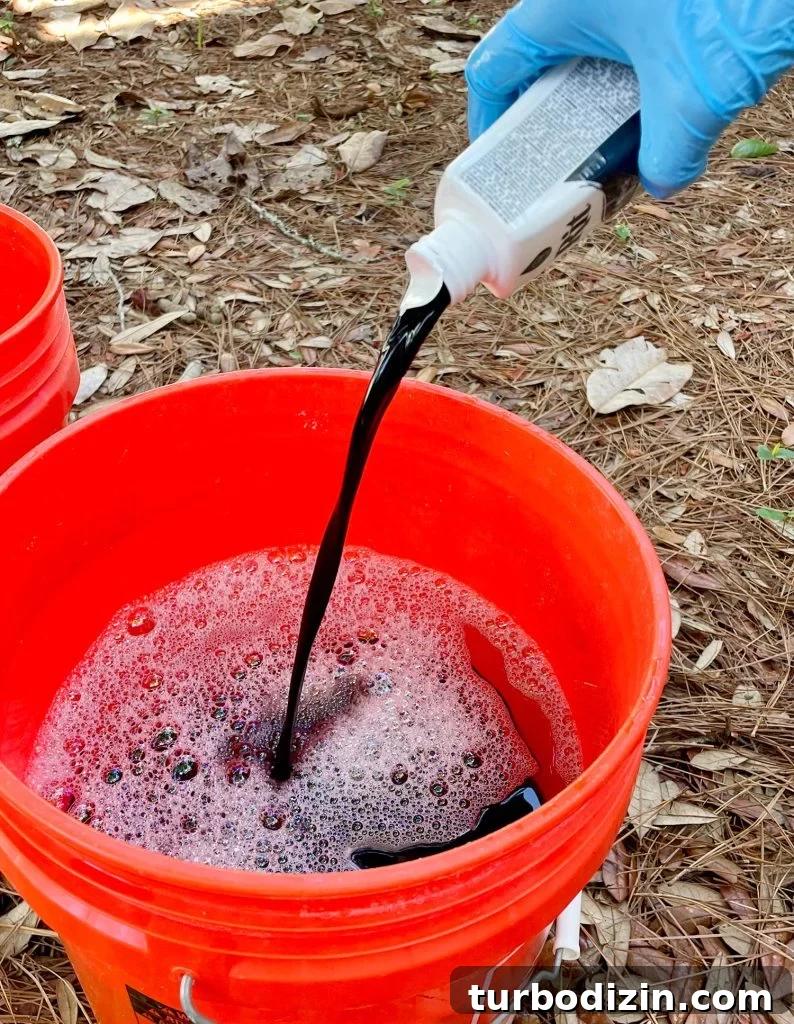 How to Dye Clothes at Home: Step-by-Step Guide for Vibrant Results 10 Pouring Bottle Of Black Rit Fabric Dye Into Hot Water Bucket