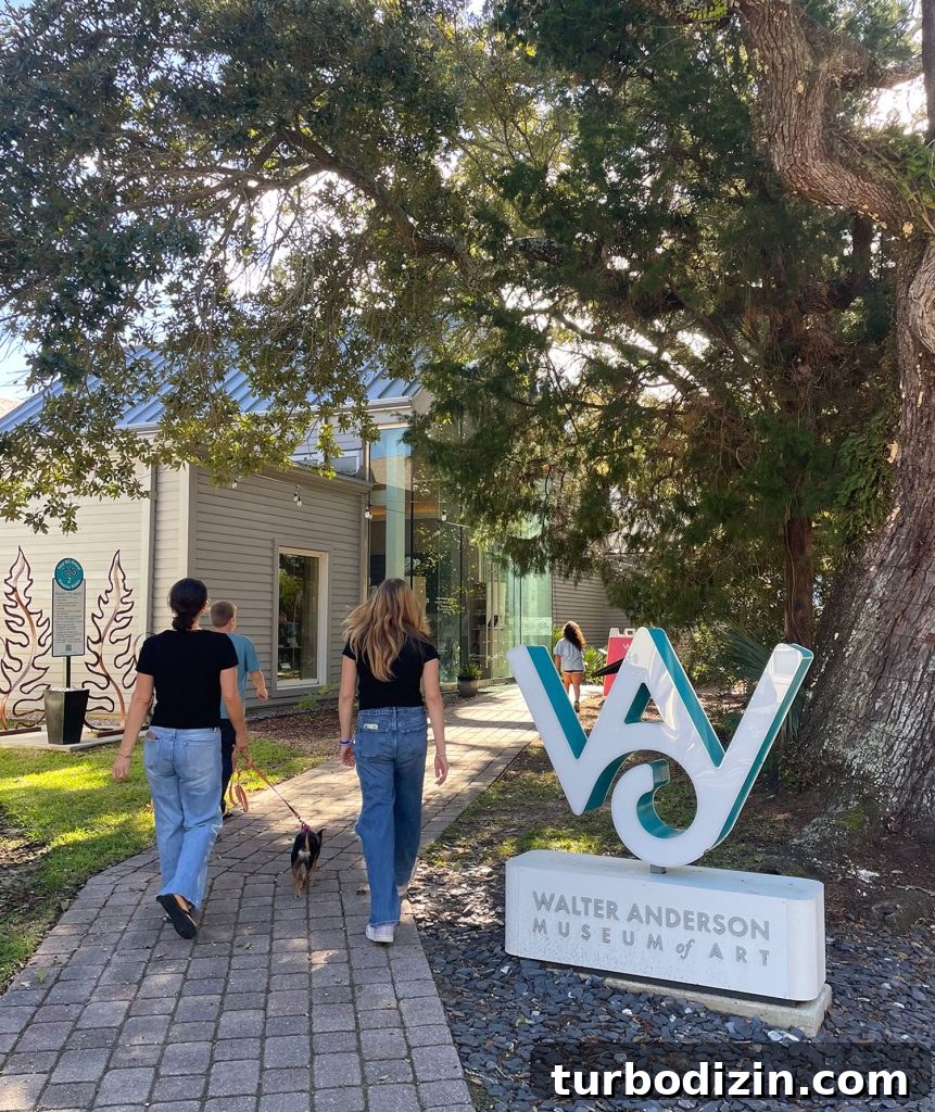 Weekend Escape to Ocean Springs: Coastal Things to Do and See 20 Family Walking into Walter Anderson Museum of Art In Ocean Springs Mississippi