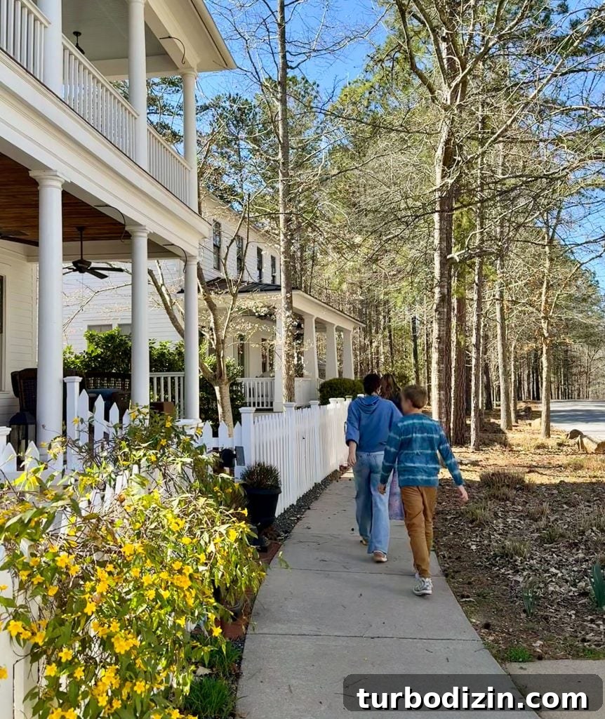 Weekend Escape to Serenbe, Georgia: What to See & Do 5 Family Walking Past Homes In Serenbe Georgia