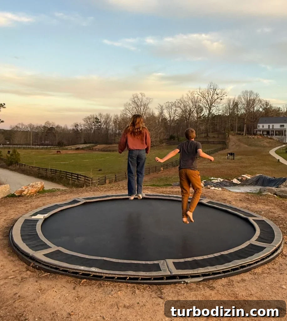 Weekend Escape to Serenbe, Georgia: What to See & Do 8 Kids Jumping On In Ground Trampoline in Serenbe Georgia