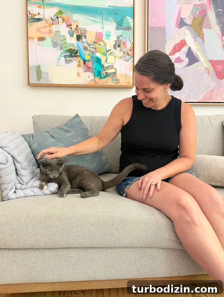 How I Reduced My Cat Allergies: Treatments That Helped Me 2 Sherry petting Jenny Cat On Couch Vertical Crop
