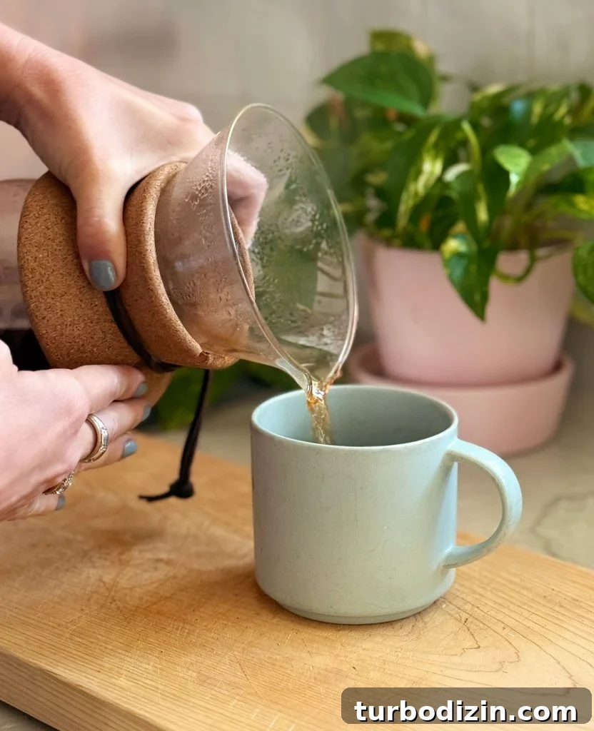 Cold Brew Coffee at Home: Step-by-Step Guide for Smooth Flavor 13 Pouring Pour Over Coffee Into Mug