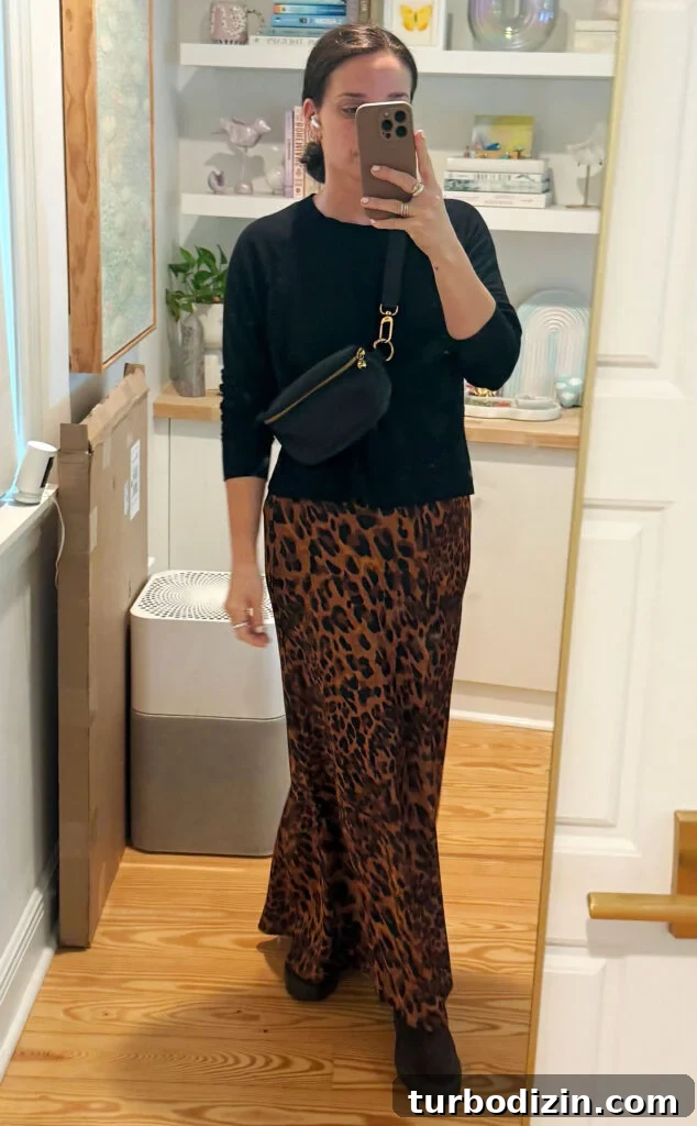 Packing Light for Italy: My Proven Minimalist Travel Wardrobe 12 Sherry Mirror Selfie In Outfit For Italy Black Sweater Leopard Maxi Skirt