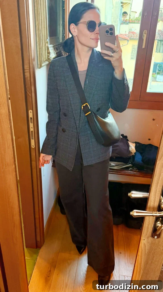 Packing Light for Italy: My Proven Minimalist Travel Wardrobe 13 Sherry Mirror Selfie In Outfit For Italy Tweed Blazer Brown Pants