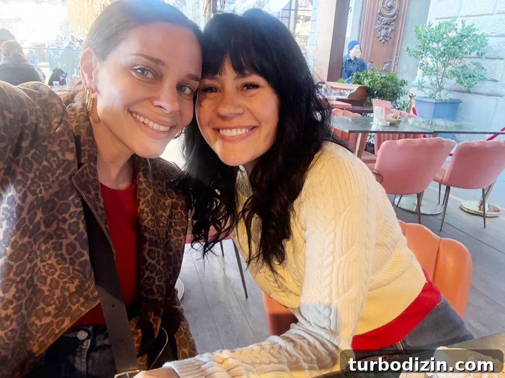 Packing Light for Italy: My Proven Minimalist Travel Wardrobe 9 Sherry Selfie With Elsie A Beautiful Mess In Florence Italy With Leopard Coat