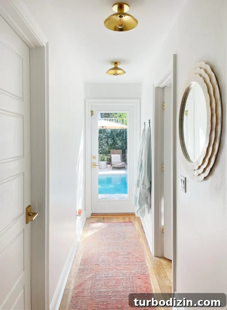 Renovating Our Home After Five Years: Before, Plans & Reveal 9 Hallway With Traditional Rug Leading To Pool