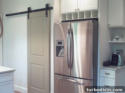 Rachel kitchen barn door and laundry nook view 5