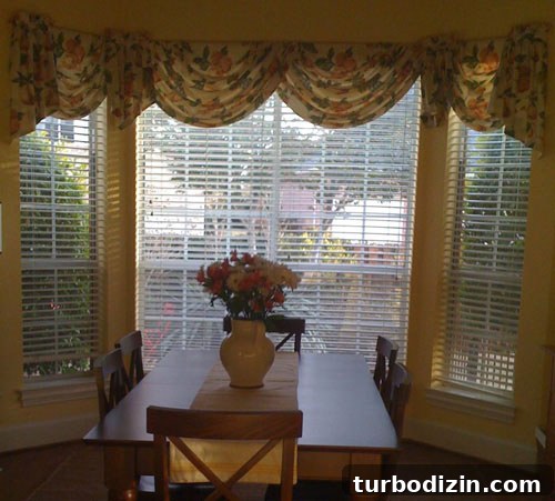 18 Expert Tips for Properly Hanging Curtains and Blinds 4 dated bay window in kitchen breakfast nook with floral window valance