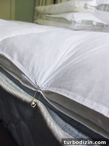 Secure Your Mattress Topper with Safety Pins: Quick Fix Guide 2 Featherbed mattress topper secured with pins