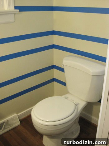 taping-off-stripes-on-the-wall