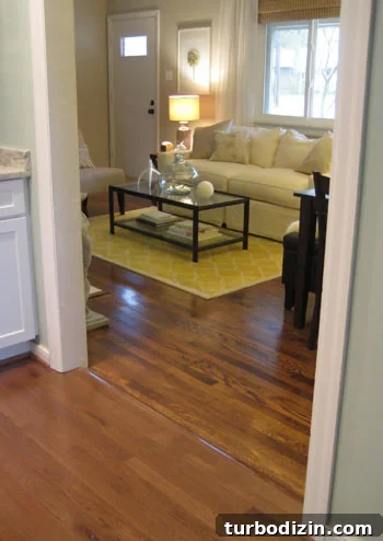 img_1991 clean hardwood floor showing transition between original oak hardwood and engineered hardwood installed to closely match
