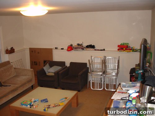 Family Room Makeover: Transform with a Green Rug and Cozy Accents 2 basement-den-makeover-before
