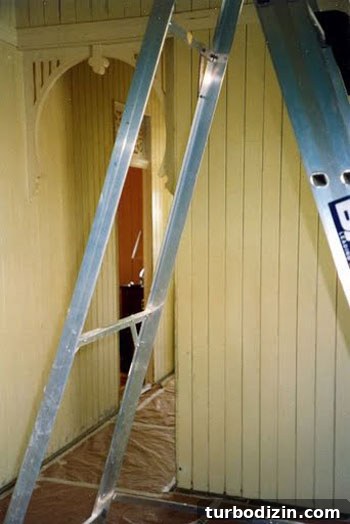 How to Paint Old Wood Paneling Teal for a Modern Look 2 Living room before