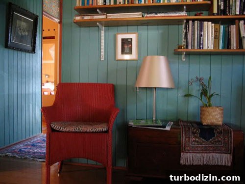 How to Paint Old Wood Paneling Teal for a Modern Look 3 Living room during transformation