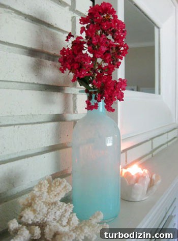 Affordable Myrtle Gardening: Grow Stunning Blooms on a Budget 4 Crape myrtle branch styled in blue vase on mantel