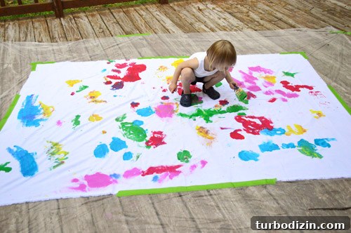 How to Paint Fabric for Fun: Tips, Techniques, and Project Ideas 3 Child painting on fabric