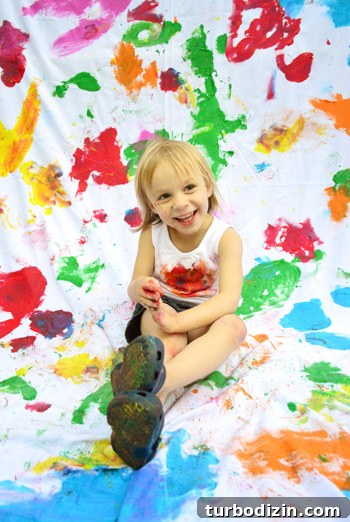 How to Paint Fabric for Fun: Tips, Techniques, and Project Ideas 9 Sitting photo with paint