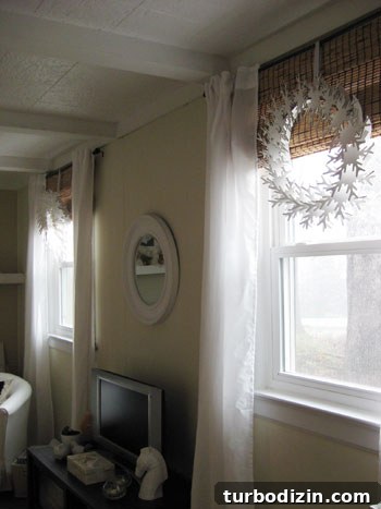 Snowflake wreath hanging in window