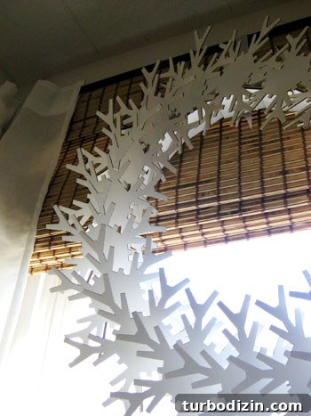 Close-up of cardboard snowflake wreath