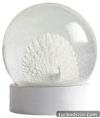 Unexpected Christmas Surprises That Will Brighten Your Holiday 2 Ceramic peacock in a snow globe