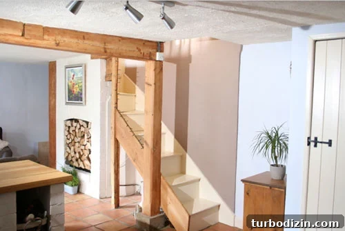 8 Controversial Home Decor Topics We Break Down 8 exposed light wood beam in english cottage including exposed staircase