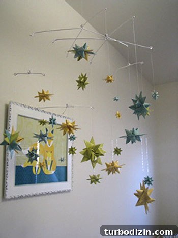 DIY Baby Mobile Featuring Folded Moravian Star Ornaments 3 DIY paper star mobile 2