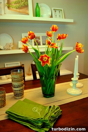 Affordable May Flowers: Creative Spring Bouquet Ideas 7 Colorful tulips in a green vase on a dining table