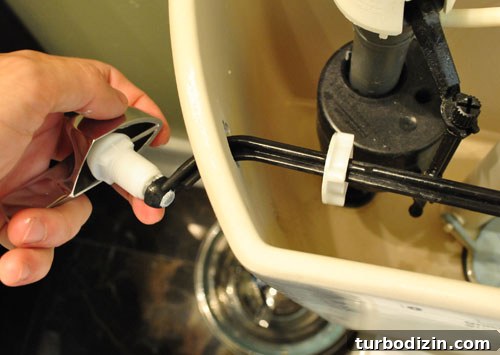 Removing old single flush lever from toilet