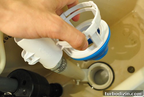Sliding dual flush converter onto toilet tank gasket