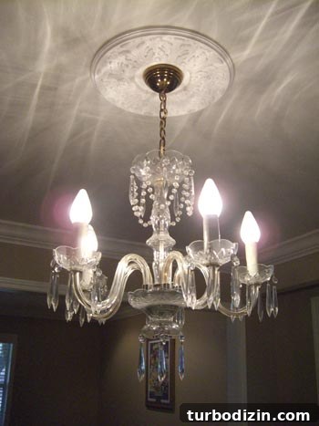 Update a Chandelier to a Modern Look by Adding a Shade 2 Chandelier before
