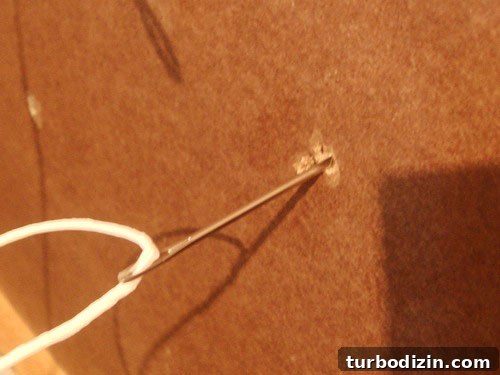 DIY Ottoman Build: Step-by-Step Guide to a Stylish Upholstered Footstool 8 threaded needle