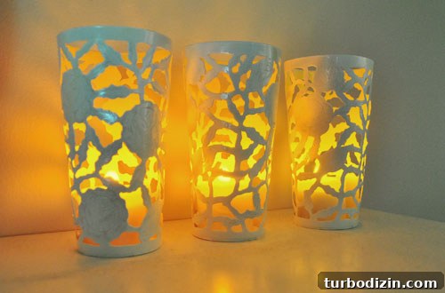 Flameless candle glowing inside painted cup