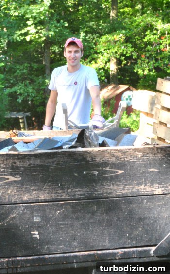 What to Know Before Getting a New Roof: Your Top Questions Answered 8 John loading debris