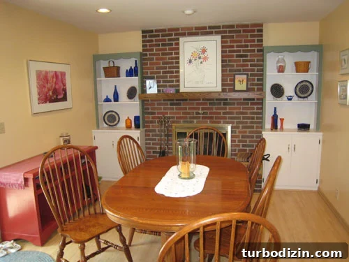 Before: multicolored dining room with patterned wallpaper and mismatched decor
