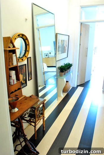 Historic Meets Modern Home Tour: Inside a Stunning Renovation 9 Striped hallway floor transition