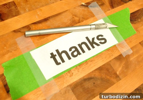 Thanksgiving Thanks Jar Craft: DIY Glass Gratitude Gift 4 Cutting a homemade stencil of the word THANKS on a cutting board with knife