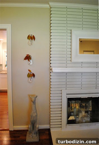 Small cherry branches in hanging glass vases