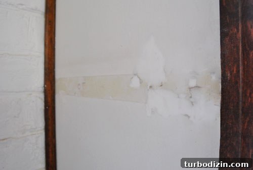 How to Remove Wall Shelves and Patch Spackle Holes 7 Patched wall