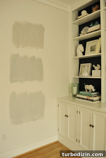 How to Choose the Perfect Gray Paint Color for Your Home 6 testing gray paint swatch colors on the wall during nighttime light
