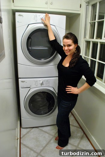Why We Chose the Whirlpool Duet Stackable Washer and Dryer 6 Sherry reaching washer controls