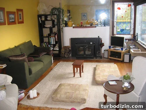 before Before: curved concrete fireplace mantle and frameless mirror