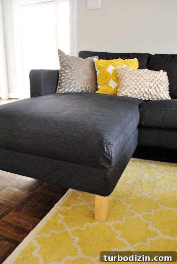 How We Assembled the IKEA Karlstad Sectional Sofa Step-by-Step 11 chaise portion of ikea sectional sofa in dark sivik gray with yellow accents