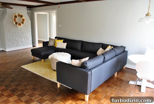 How We Assembled the IKEA Karlstad Sectional Sofa Step-by-Step 4 dark gray Karlstad ikea sectional sofa recently assembled in gray living room with fireplace