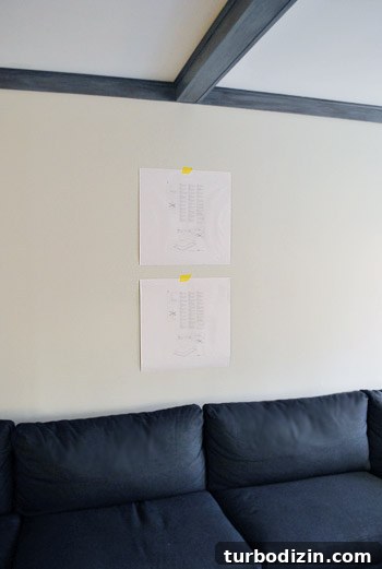 How to Hang a Picture Frame Grid Perfectly 4 two paper templates taped