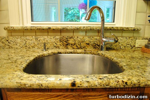 Offset faucet filling a pot on the counter