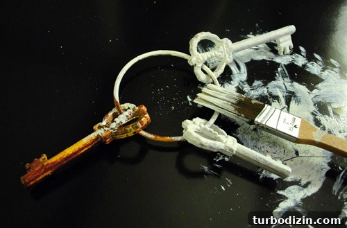 How to Paint and Hang Large Metal Keys on Your Wall 3 Close-up of painted keys drying