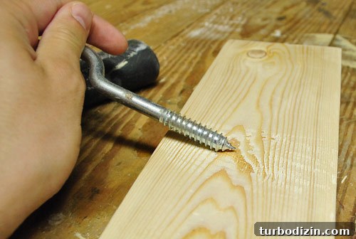 Make New Wood Look Aged: Simple Techniques for Authentic Patina 12 scraping course screw across new wood board to create distressed effect for DIY project