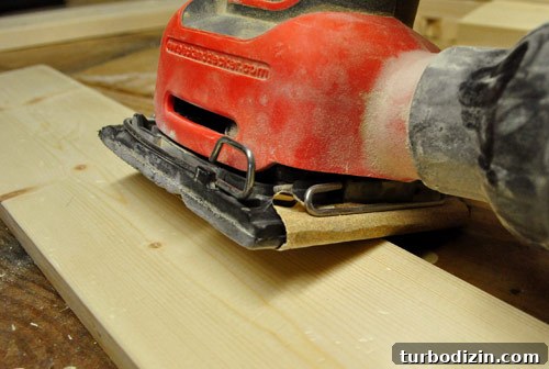 Make New Wood Look Aged: Simple Techniques for Authentic Patina 5 using a black & decker palm sander to smooth edges of wood board