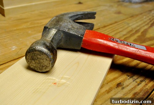 Make New Wood Look Aged: Simple Techniques for Authentic Patina 8 hitting hammer against new whitewood board to make it look old, distressed, and reclaimed